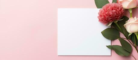 Photo of a white paper with pink flowers on a pink background, with space for text or other elements with copy space