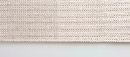 Photo of a textured fabric close up on a wooden table with copy space