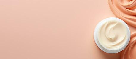 Photo of a cream bottle on a vibrant pink background with empty space for text or design with copy space