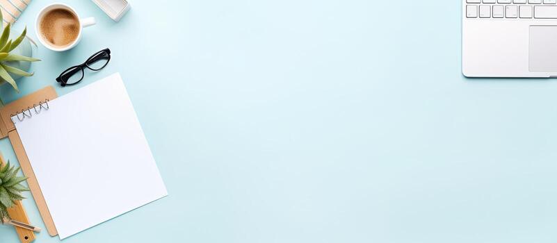 Photo of a laptop computer and a plant on a desk with empty space for text with copy space