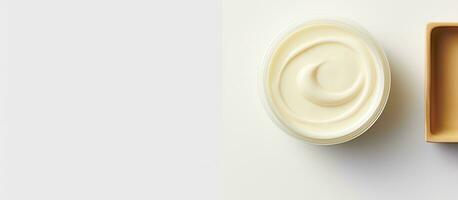 Photo of a bowl of yogurt and a container of yogurt with copy space with copy space