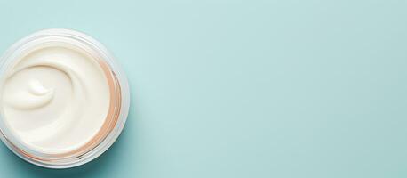 Photo of a jar of cream on a vibrant blue background with plenty of copy space with copy space