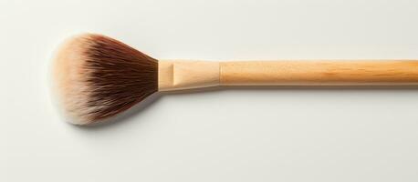 Photo of a wooden brush on a white surface, perfect for copy space design with copy space