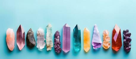 Photo of a vibrant display of colorful crystals on a serene blue backdrop with copy space