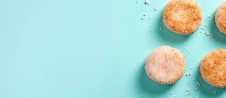 Photo of a variety of cookies on a vibrant blue background with copy space