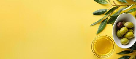 Photo of olives in a white bowl on a yellow background with plenty of copy space with copy space