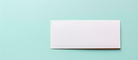 Photo of a blank white paper against a vibrant blue background, providing ample copy space for text or design elements with copy space
