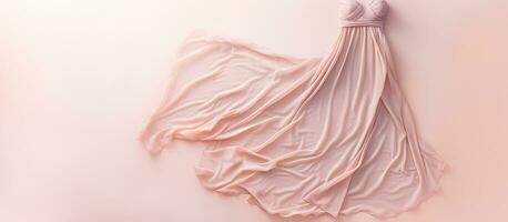 Photo of a pink dress hanging on a wall with empty space for text or design with copy space