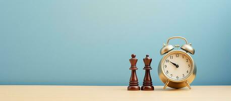 Photo of an alarm clock next to a chess set, creating a concept of time management and strategy with copy space