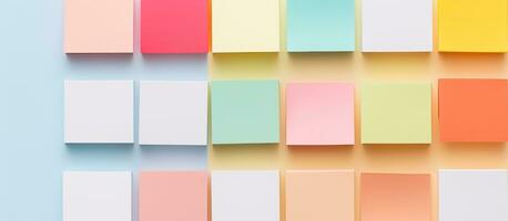 Photo of pastel colored papers arranged in neat rows, perfect for adding your own text or design with copy space