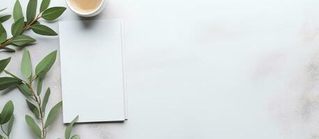Photo of a cup of coffee on a white paper with plenty of space for text or other elements with copy space