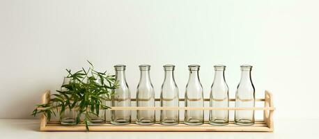 Photo of a row of glass bottles on a wooden tray with plenty of empty space for copy with copy space