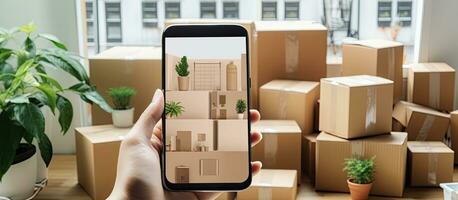 Photo of a person holding a cell phone in front of stacked boxes with plenty of copy space with copy space