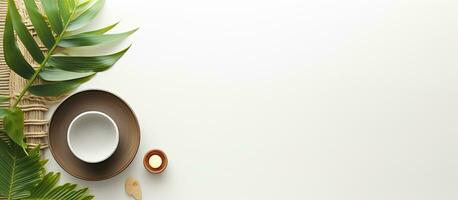 Photo of a cup of coffee next to a plant on a wicker mat with copy space with copy space