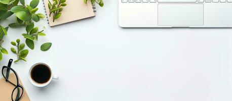 Photo of a laptop computer and cup of coffee on a desk, with plenty of space for your own creative work with copy space