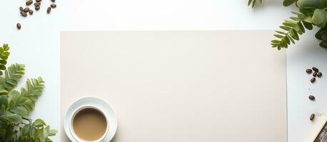 Photo of a cup of coffee next to a blank paper, with plenty of copy space to write or draw on with copy space