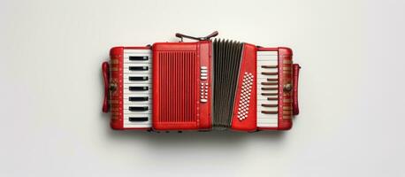 Photo of a vibrant red accordion against a clean white wall, creating a striking contrast with copy space