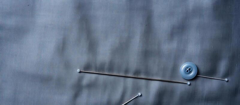 Photo of two blue buttons on a wooden table with plenty of space for your own text with copy space