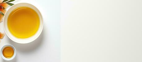 Photo of a cup of tea and an orange flower on a table with plenty of space for your own message with copy space