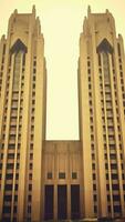 AI Generative Pair of tower spires on exterior of modern coptic christian church in middle east photo