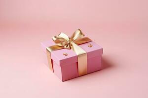 Gift box with golden satin ribbon and bow on pink background. Generative AI photo
