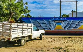 Puerto Escondido Oaxaca Mexico 2023 Wall with graffiti art drawings paintings in Puerto Escondido Mexico. photo