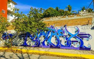 Puerto Escondido Oaxaca Mexico 2023 Wall with graffiti art drawings paintings in Puerto Escondido Mexico. photo