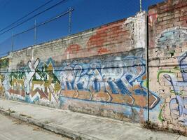 Puerto Escondido Oaxaca Mexico 2023 Wall with graffiti art drawings paintings in Puerto Escondido Mexico. photo