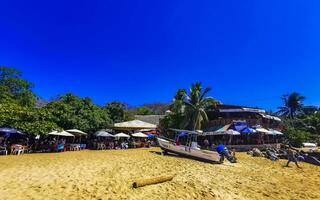 Puerto Escondido Oaxaca Mexico 2023 Boats harbor yacht beach people Puerto Angelito Puerto Escondido Mexico. photo