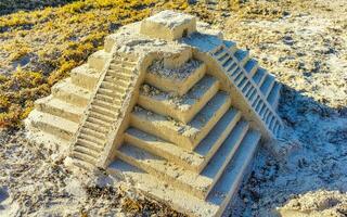 Chichen Itza pyramid of sand on the Caribbean beach Mexico. photo