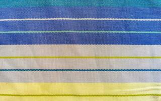 Colorful blue purple green striped table cloth texture in Mexico. photo