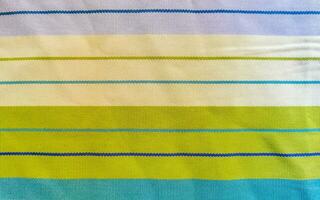 Colorful blue purple green striped table cloth texture in Mexico. photo