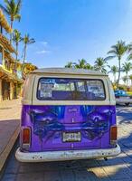 Puerto Escondido Oaxaca Mexico 2023 Old vintage classic minibuses vans transporters vehicles cars in Mexico. photo