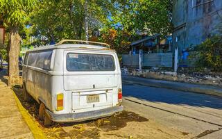 Puerto Escondido Oaxaca Mexico 2023 Old vintage classic minibuses vans transporters vehicles cars in Mexico. photo