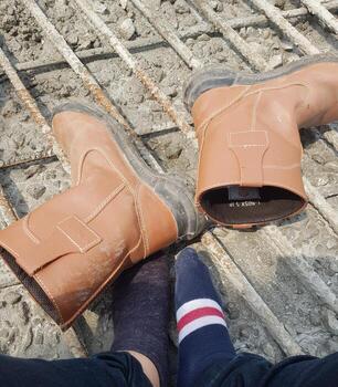 An exhausted engineer wears a pair of socks that are different colors and different patterns. photo