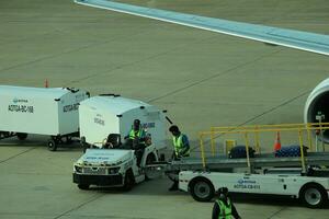 Bangkok, Thailand on July 9, 2023. Loading process into the Unit Load Device of AOTGA at Don mueang International Airport. photo