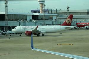 Bangkok, Thailand on July 9, 2023. Juneyao Air plane on the apron of Don Mueang International Airport. photo