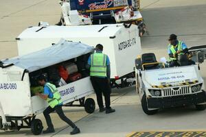 Bangkok, Thailand on July 9, 2023. Loading process into the Unit Load Device of AOTGA at Don mueang International Airport. photo