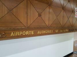 A wall reads, Airports Authority of Thailand photo