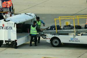 Bangkok, Thailand on July 9, 2023. Loading process into the Unit Load Device of AOTGA at Don mueang International Airport. photo