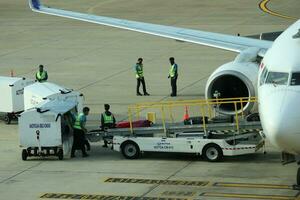 Bangkok, Thailand on July 9, 2023. Loading process into the Unit Load Device of AOTGA at Don mueang International Airport. photo