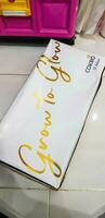 Bekasi, Indonesia in May 2018. A Bluder Cokro box, with Grow to Glow written on it. Bluder Cokro is a typical Madiun cake or cake photo