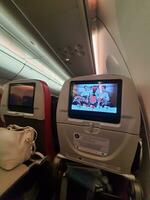 Jakarta, Indonesia on July 9, 2023. A screen on a Batik Air airplane seat for in-flight entertainment. photo
