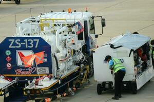 Bangkok, Thailand on July 9, 2023. Loading process into the Unit Load Device of AOTGA at Don mueang International Airport. photo