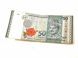 Isolated white photo of one ringgit malaysian bank notes.