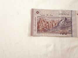 Isolated white photo of one piece of 100 ringgit malaysian bank notes