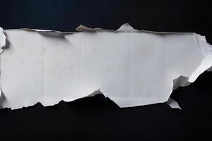 Torn Paper on Black Background. photo
