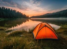 tourist lit tent by the lake at sunset. Dramatic sky. Orange lit inside the tent and a fire over the misty river at sunset. Dramatic sunset. Summer landscape. Created with Generative AI technology. photo