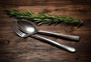 Rustic vintage set of cutlery knife, spoon, fork. Black background. Top view. Created with technology. photo