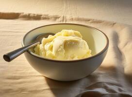 Bowl with tasty vanilla ice cream on table against light background. Created with Generative AI technology. photo